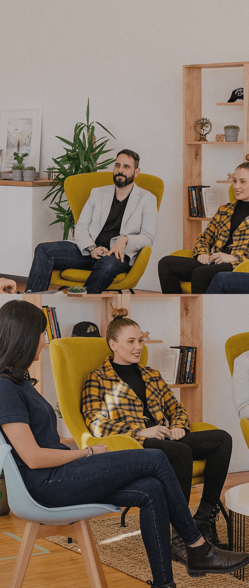 People having a conversation in a modern office setting
